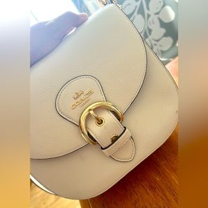 COACH Saddle Bag with both a shoulder strap and a detachable crossbody strap